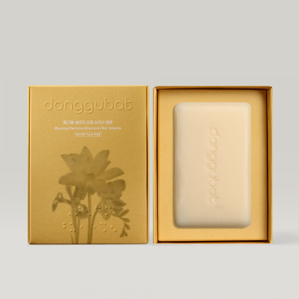 DONGGUBAT Field Blooming Perfume Shampoo Bar Volume 80g in elegant packaging, enhancing hair volume and fragrance.