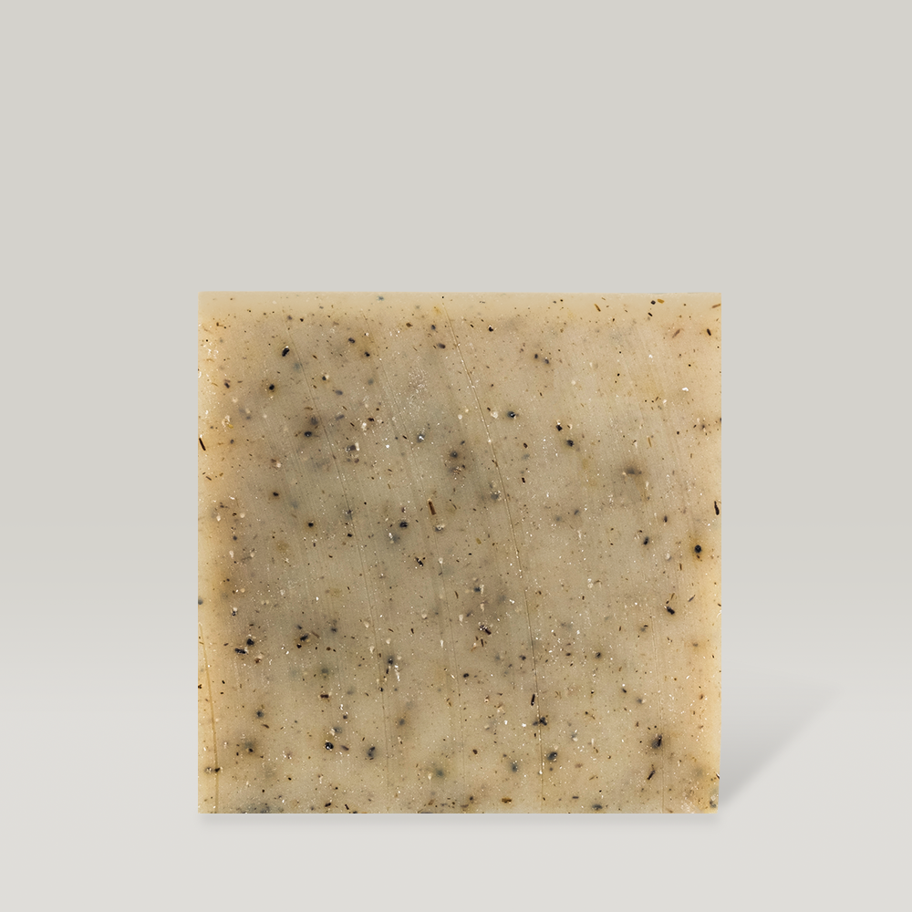 Square bar of DONGGUBAT Field Dream Soap Basil with natural speckles on a light background.