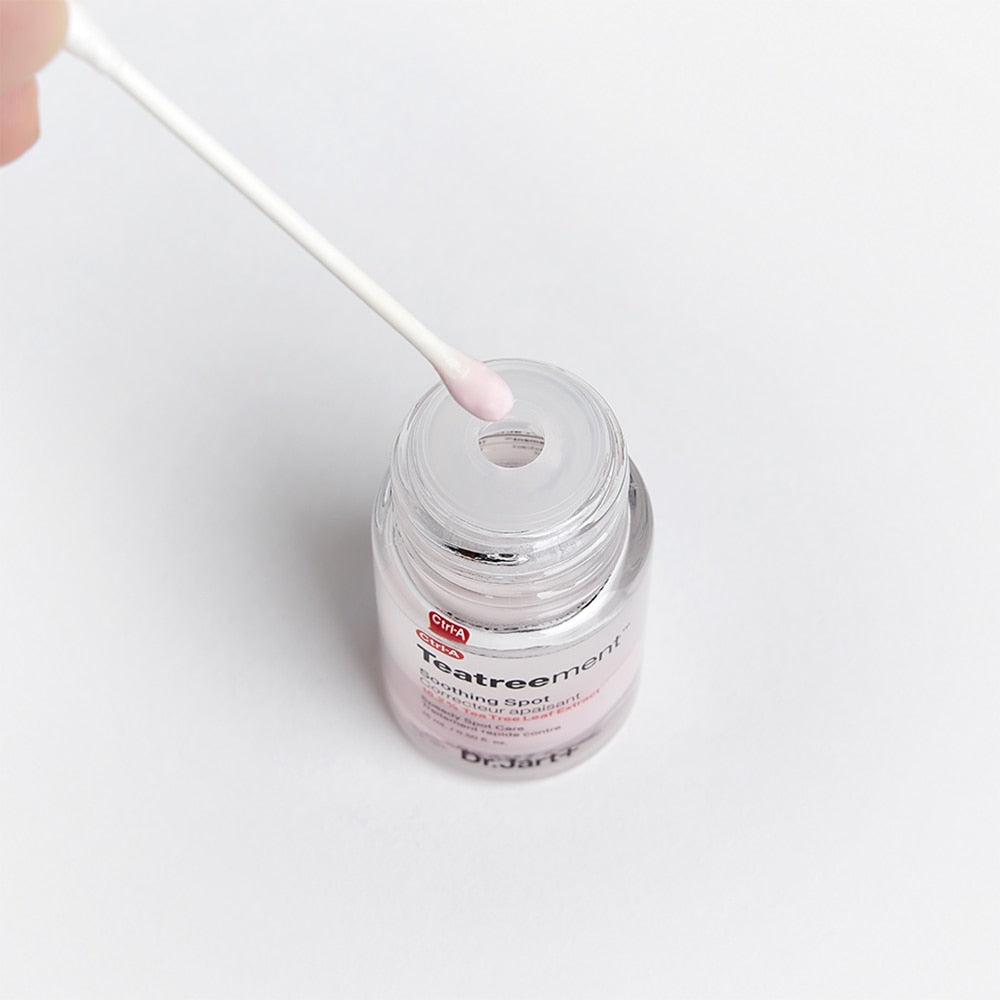 Close-up of DR. JART+ Ctrl-A Teatreement Soothing Spot 15ml jar with cotton swab
