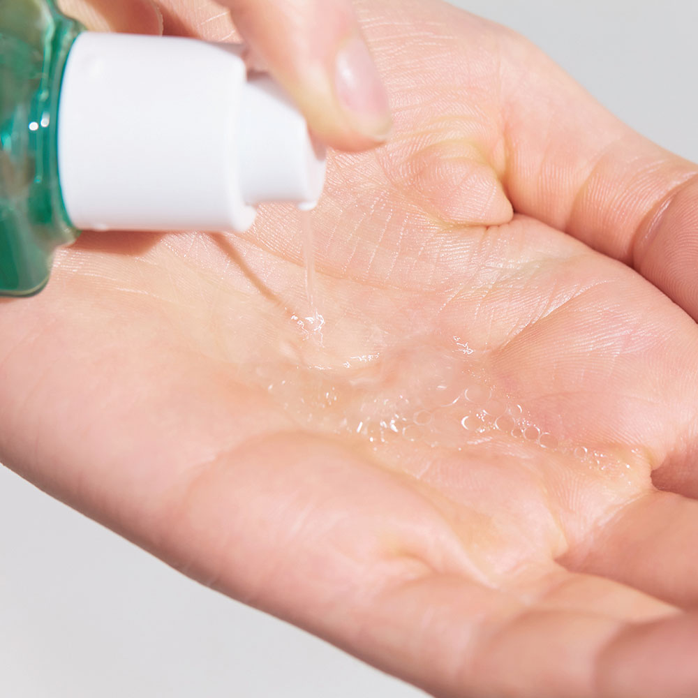 Dispensing DR. JART+ Pore Remedy PHA Exfoliating Serum 30ml onto hand.