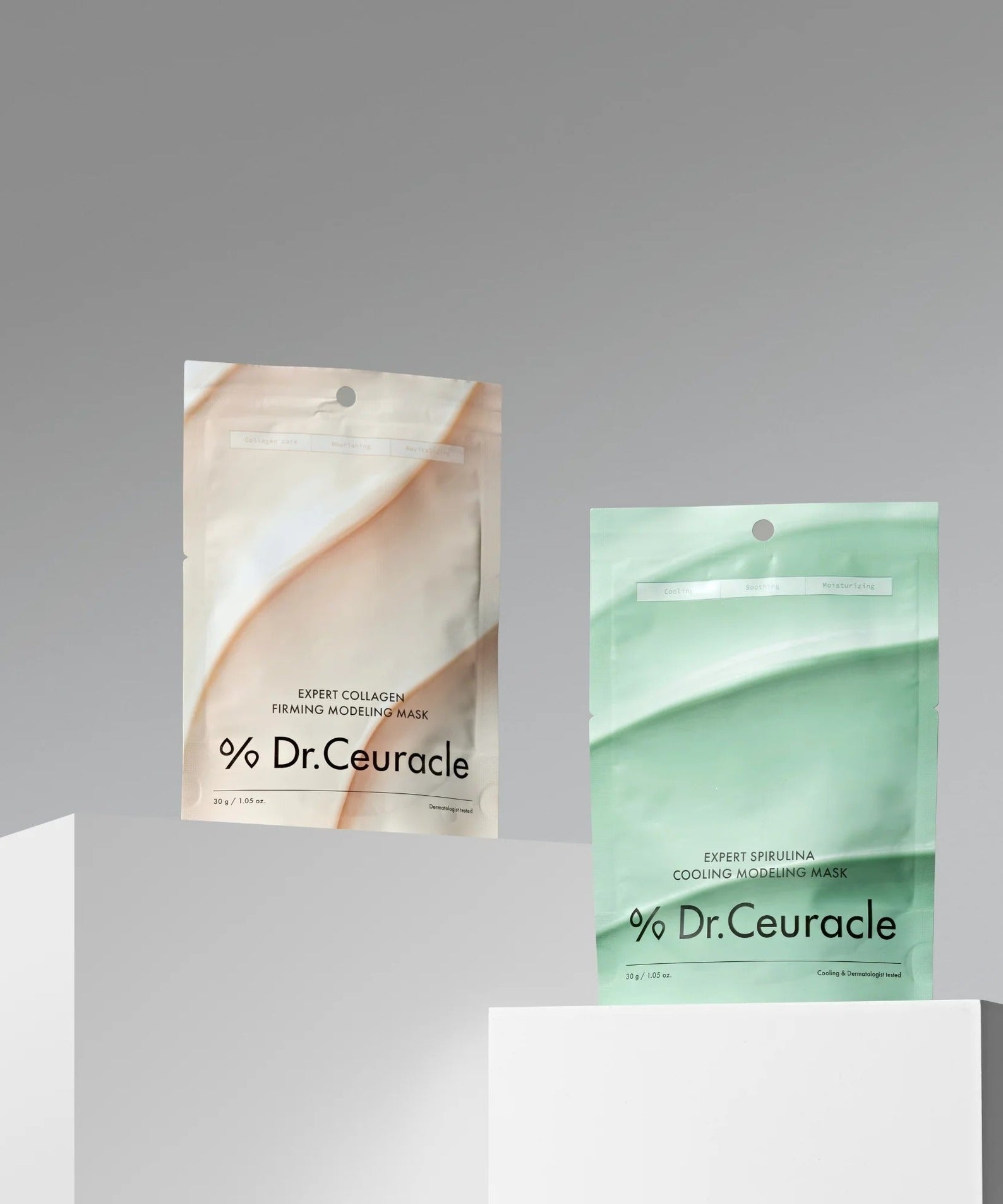 DR.CEURACLE Expert Spirulina Cooling Modeling Mask 30g and another mask on display stand.