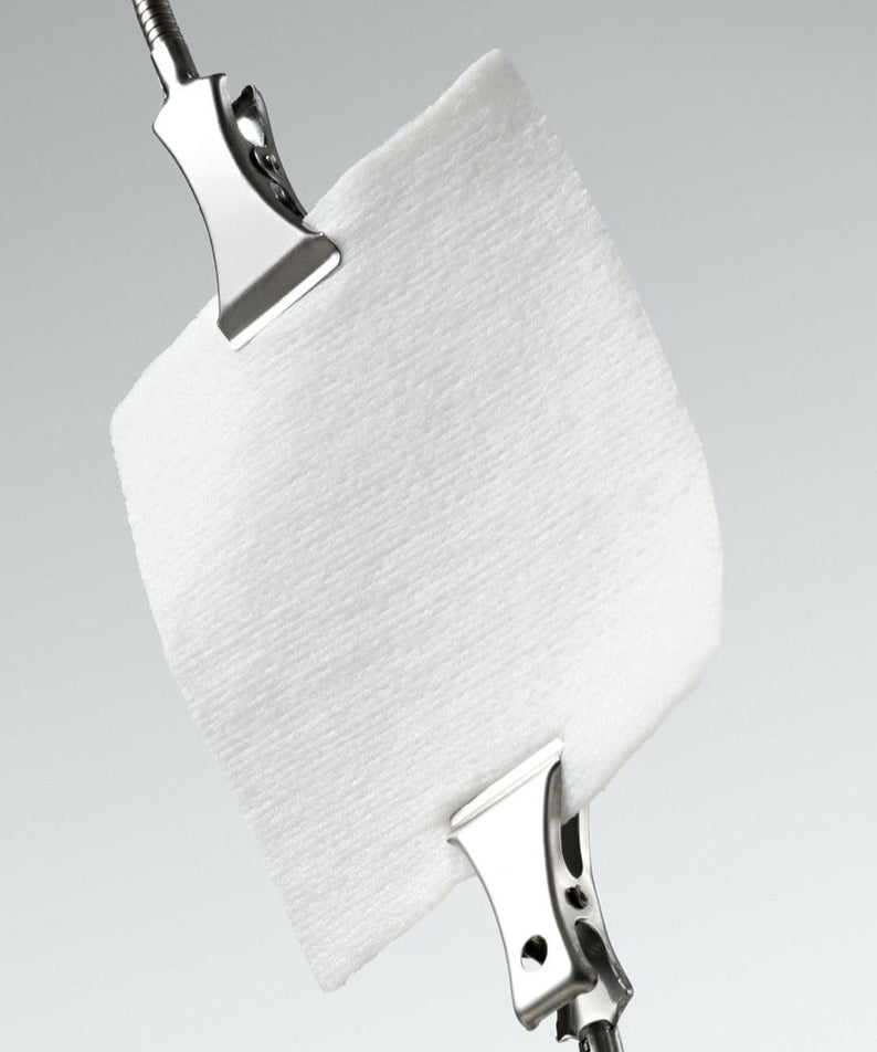 Close-up of DR.CEURACLE PLC Calming Solution Pad 130 pads with metal clips demonstrating texture