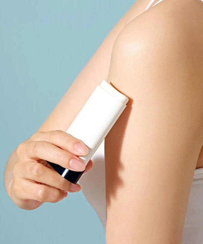 Person applying DR.CEURACLE Pro Balance Comfort Sun Stick 18g to arm