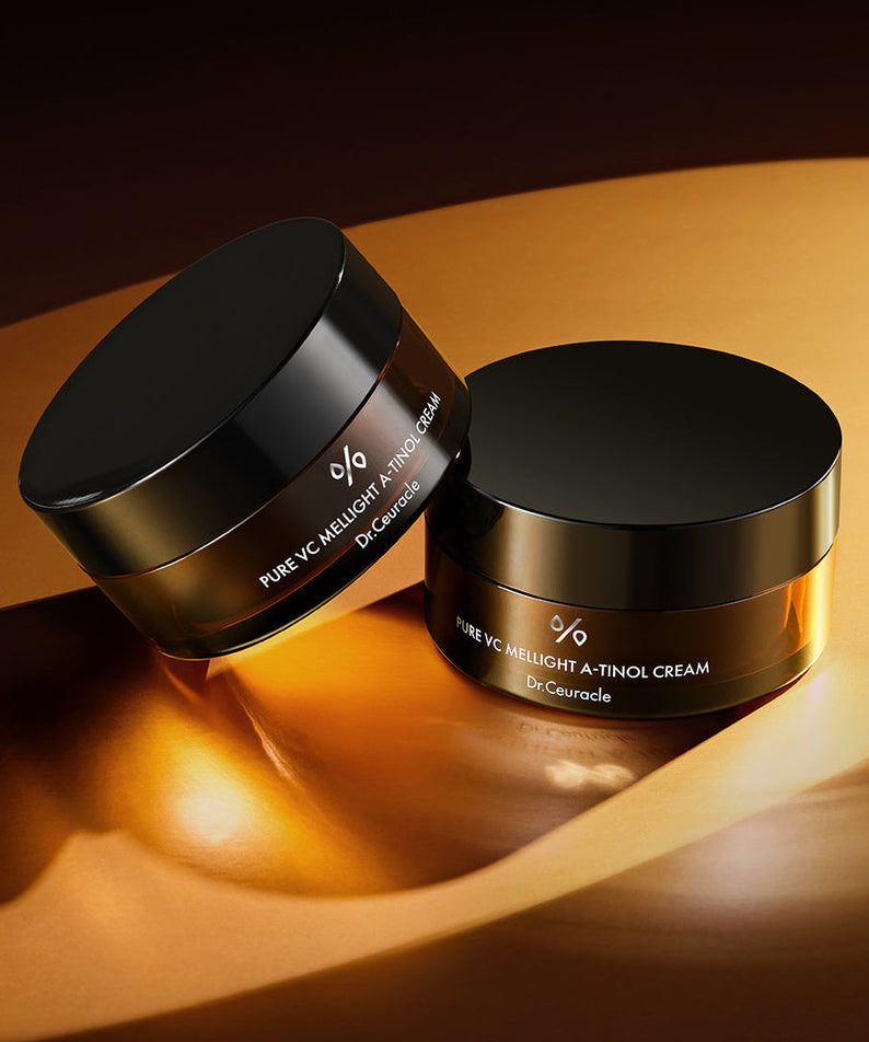 DR.CEURACLE Pure VC Mellight A-Tinol Cream 70g displayed with elegant packaging on a golden surface.