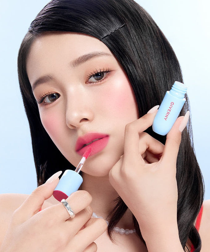 Woman applying GIVERNY Fluffy Sheer Tint 3.5g lip tint.