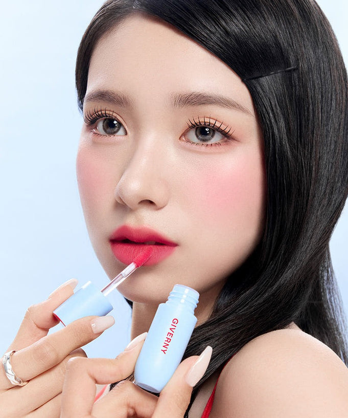 Woman applying GIVERNY Fluffy Sheer Tint 3.5g lipstick