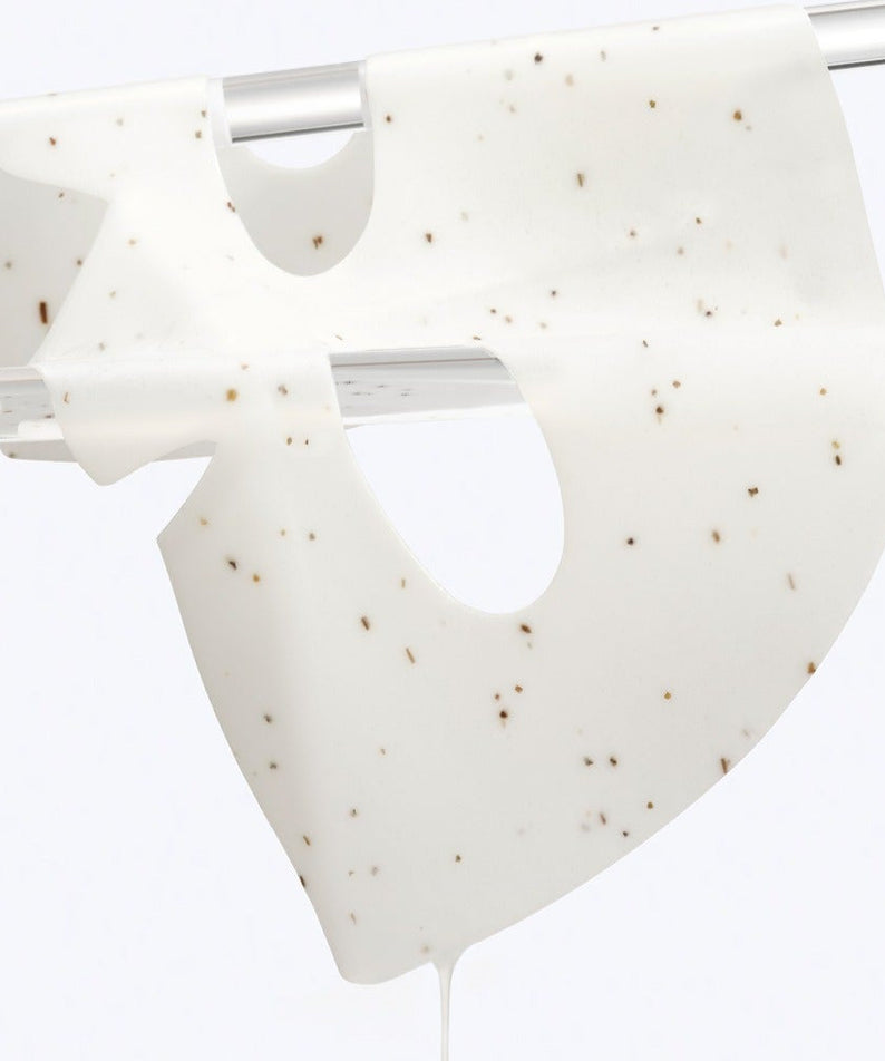 Close-up of DR.G Red Blemish Hyal Cica Cooling Gel Mask 1 Sheets on a drying rack, showcasing its texture and cooling properties.