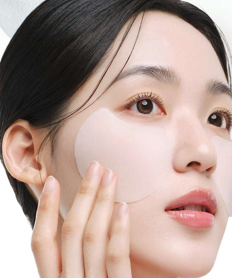 Woman applying DR.G Red Blemish Turnip Cica Icying Pads 60 Sheets to her cheek, showcasing the skincare product in use.