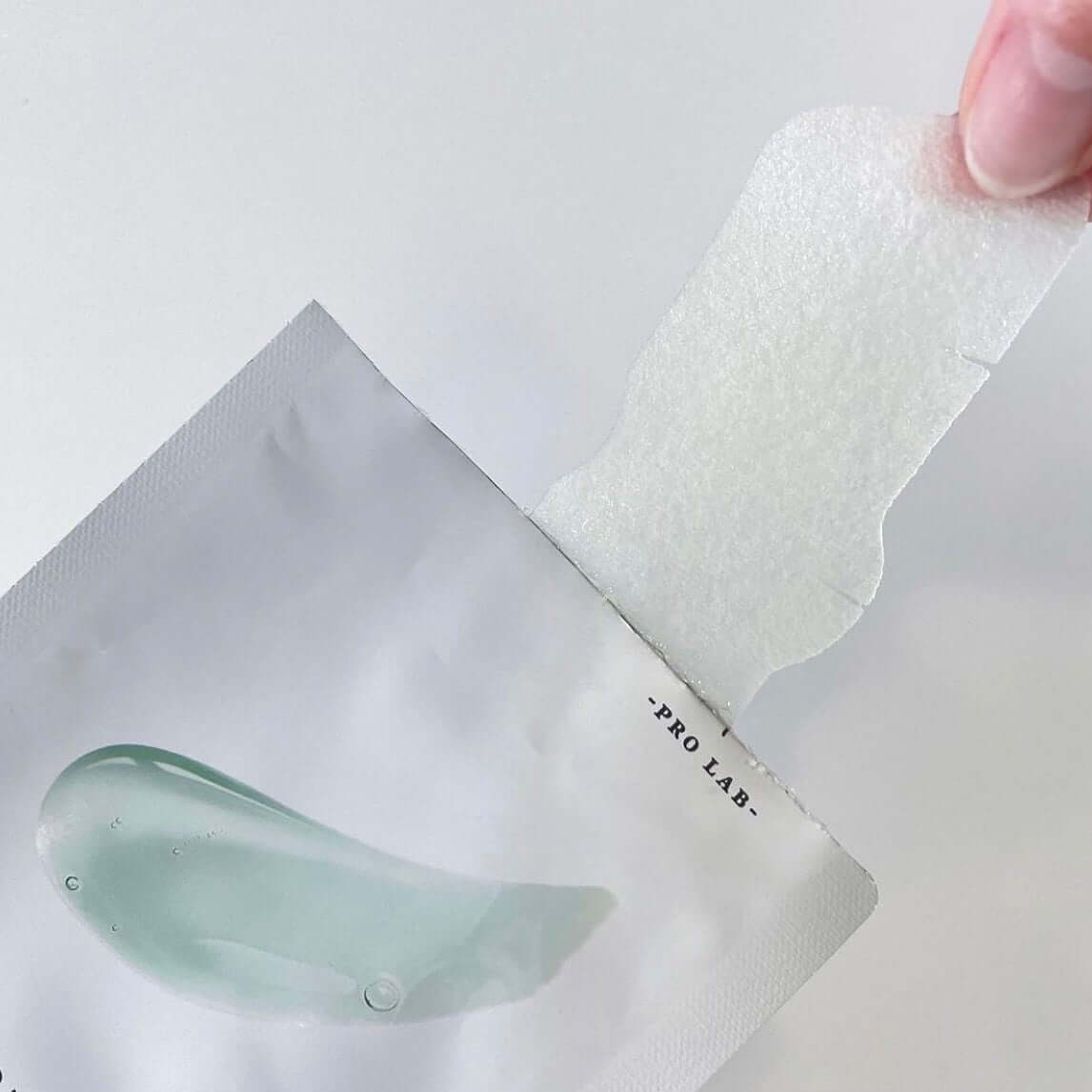 DR.ALTHEA Blackhead Zero Two Step Nose Patch being removed from packaging, showcasing product texture and quality.