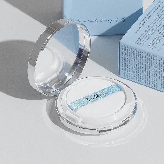 Open compact of DR.ALTHEA Double Serum Night Foundation 12g with reflected light and packaging.