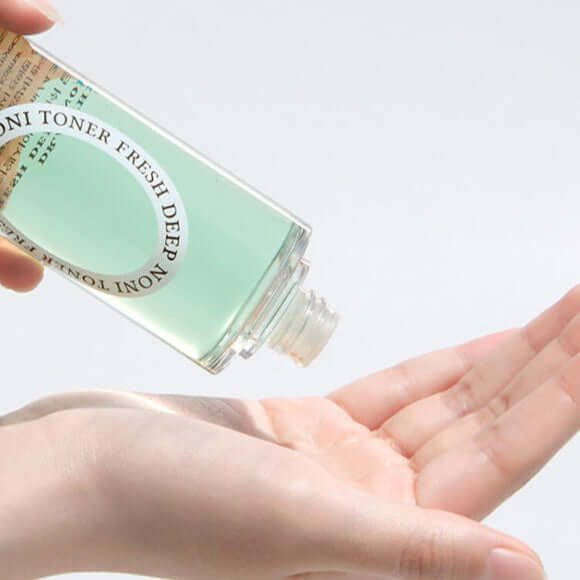 Applying DR.ALTHEA Fresh Deep Noni Toner 130ml to skin for hydration.