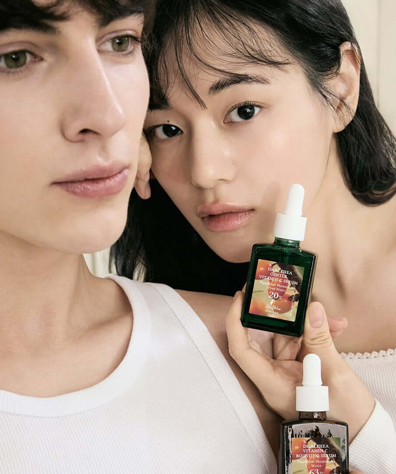 Models holding DR.ALTHEA Gentle Vitamin Serum 30ml bottle, showcasing skincare benefits.