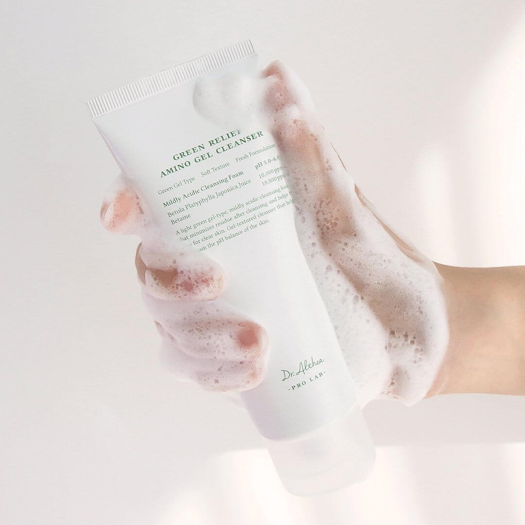 Person holding DR.ALTHEA Green Relief Amino Gel Cleanser 100ml with foam