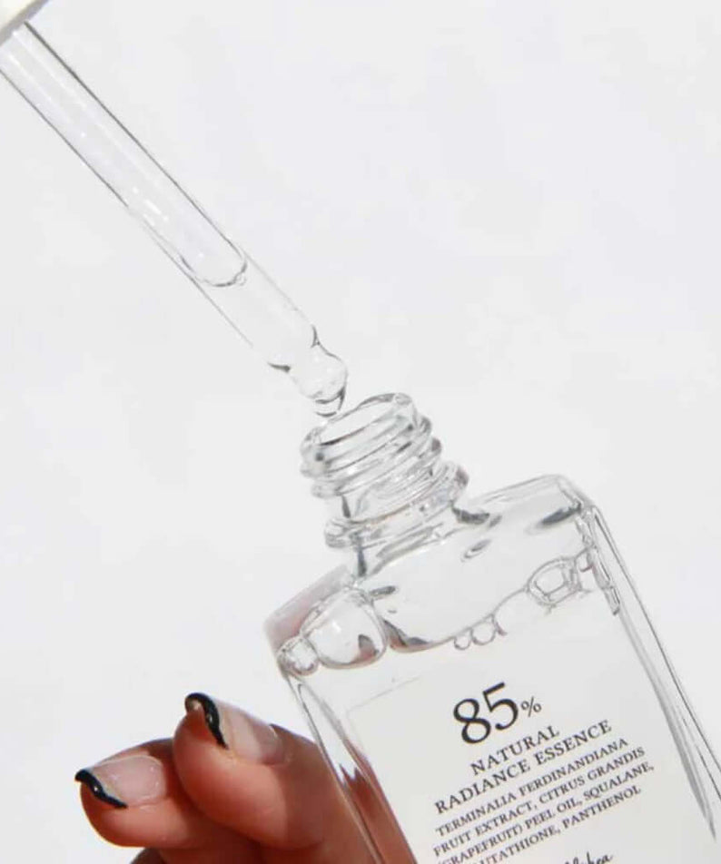 DR.ALTHEA Natural Radiance Essence 30ml, clear serum bottle with dropper showcasing the product's texture and application.