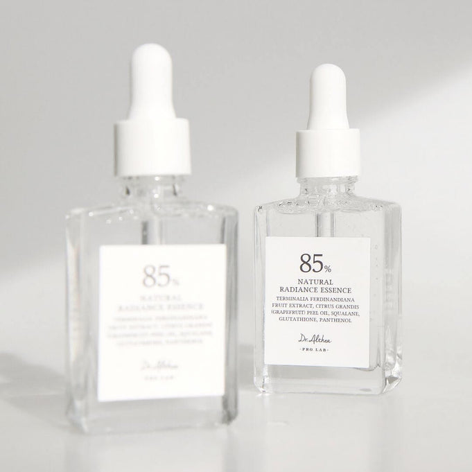 Two bottles of DR.ALTHEA Natural Radiance Essence 30ml on a white background, showcasing premium skincare product.