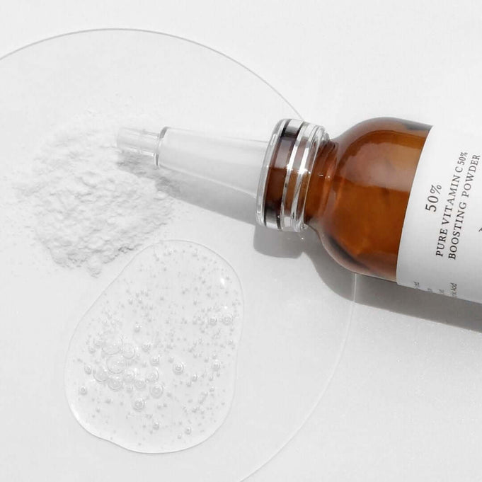 DR.ALTHEA Pure Vitamin C 50% Boosting Powder 10g bottle and texture on a white background