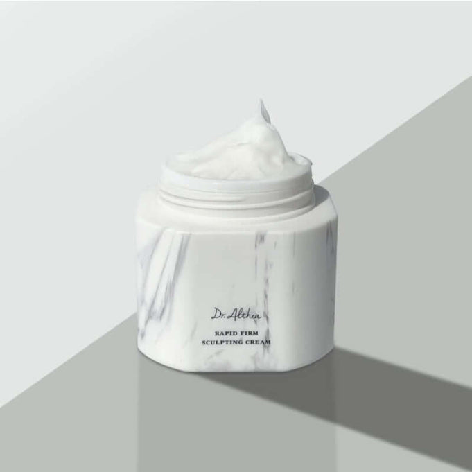 DR.ALTHEA Rapid Firm Sculpting Cream 45ml in open marble jar showcasing the texture of the cream on a minimalist background.