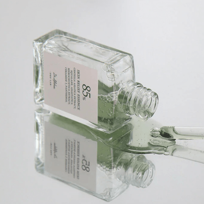 DR.ALTHEA Skin Relief Essence 30ml bottle on reflective surface, showcasing skincare product packaging.