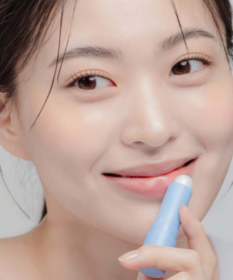 Woman applying DR.ALTHEA Soft Malting Lip Balm for smooth lips