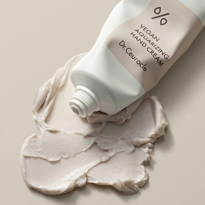 DR.CEURACLE Aqua Rising Hand cream 50ml tube with cream swatch on a neutral background.