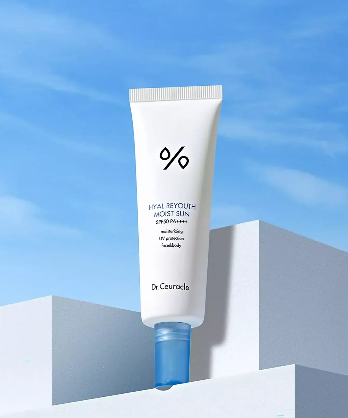 DR.CEURACLE Hyal Reyutsu Moist Sun SPF50+,PA++++ tube on geometric background with blue sky