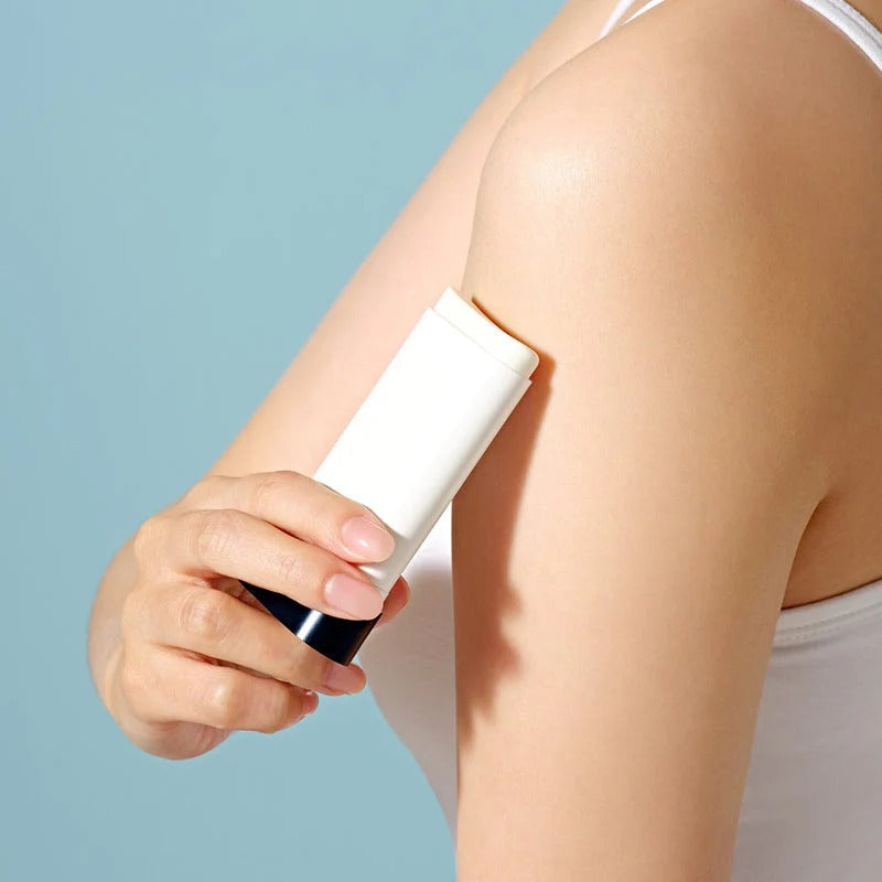 Person applying DR.CEURACLE Pro Balance Comfort Sun Stick 18g to arm