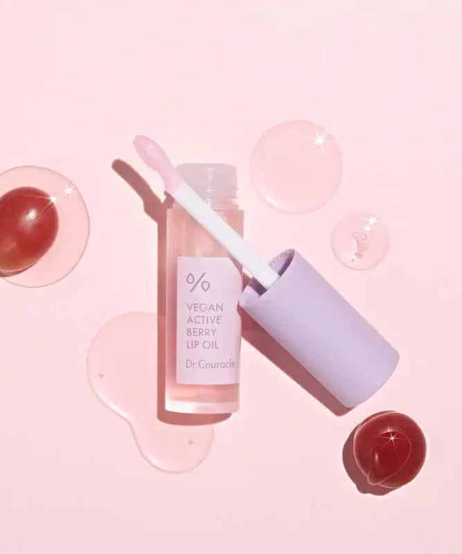 DR.CEURACLE Vegan Active Berry Lip Oil displayed with pink background and glossy texture