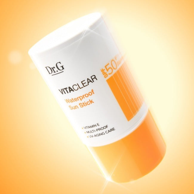 DR.G Vita Clear Waterproof Sun Stick 21g with SPF 50+, vitamin E, and UV protection, in an orange and white design.