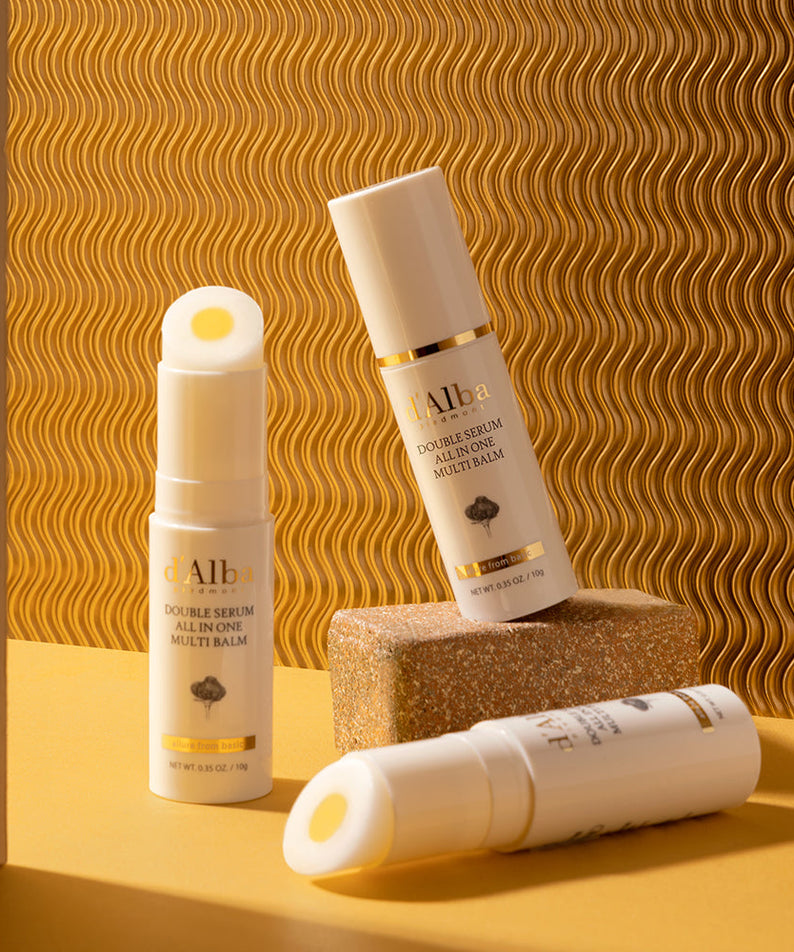 D'ALBA Double Serum All In One Multi Balm 10g displayed on a textured surface.