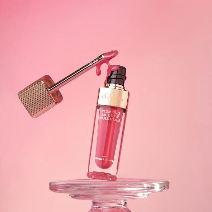 D'ALBA Plumping Lip Glow Mood Volumizer 5ml on clear stand with pink background