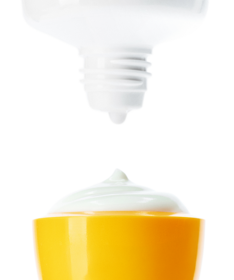 ANUA Daily Transparent Moisture Sunscreen 50ml in a yellow container with cream spilling out