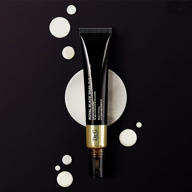 Dr.G Royal Black Snail Eye Cream 30ml tube on dark background with cream swirls, highlighting K-beauty skincare benefits.