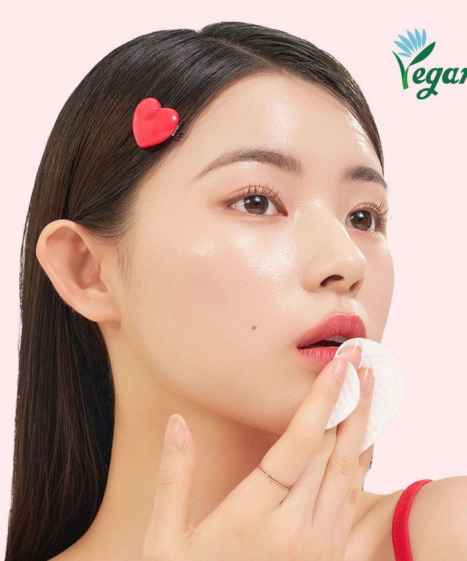 Model using EDIT.B Joyful Heart All-in-One Cleansin Pad 30 Sheets with vegan certification logo