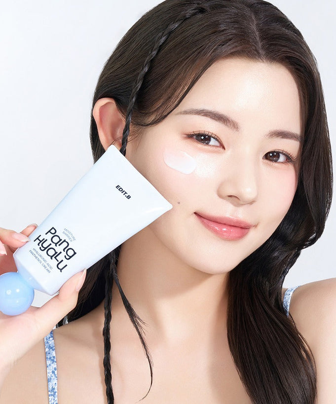 Woman holding EDIT.B Moisture Barrier Pang Hyaluronic Acid Pathenol Cream 100ml with smile.