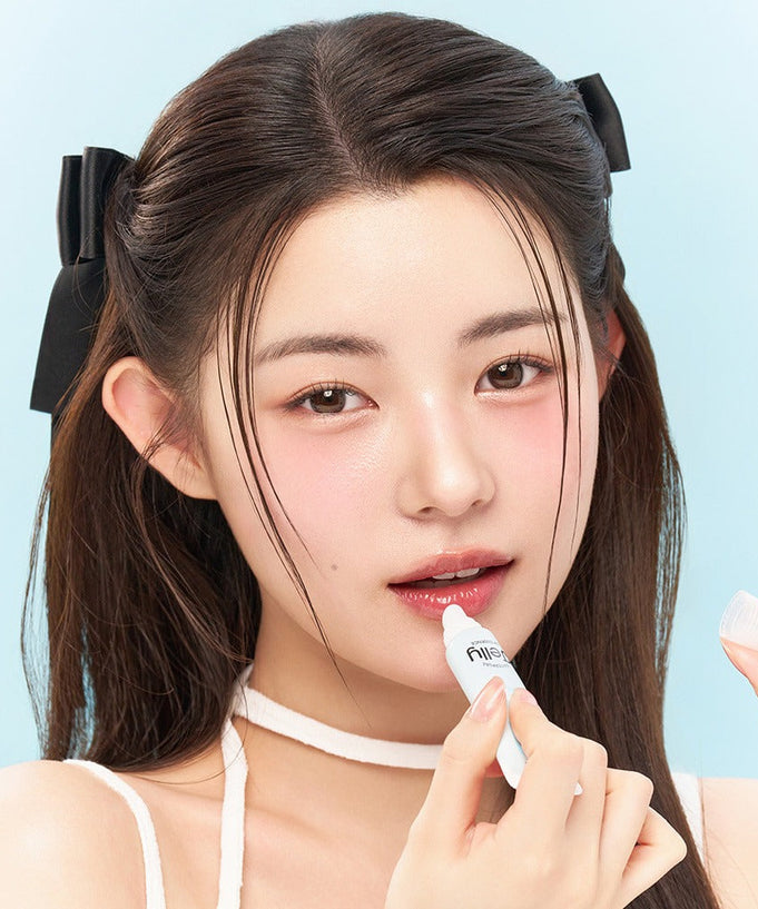 Model applying EDIT.B Waterful Jelly Lip Essence 11ml, showcasing glossy lip effect.