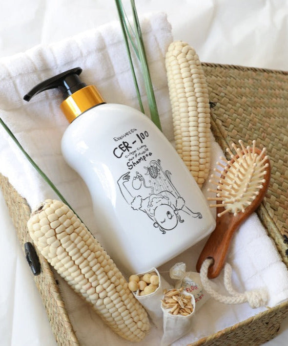 ELIZAVECCA Cer-100 Collagen Coating Hair A+ Muscle Shampoo 500ml bottle in wicker basket with corn and hairbrush