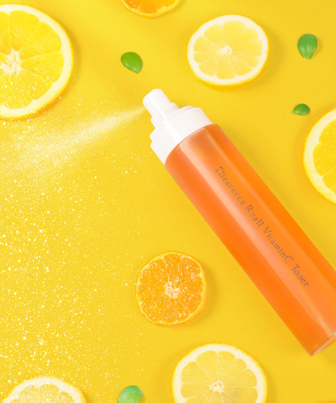 ELIZAVECCA Real One Vitamin C Toner 200ml bottle with citrus fruits on a yellow background