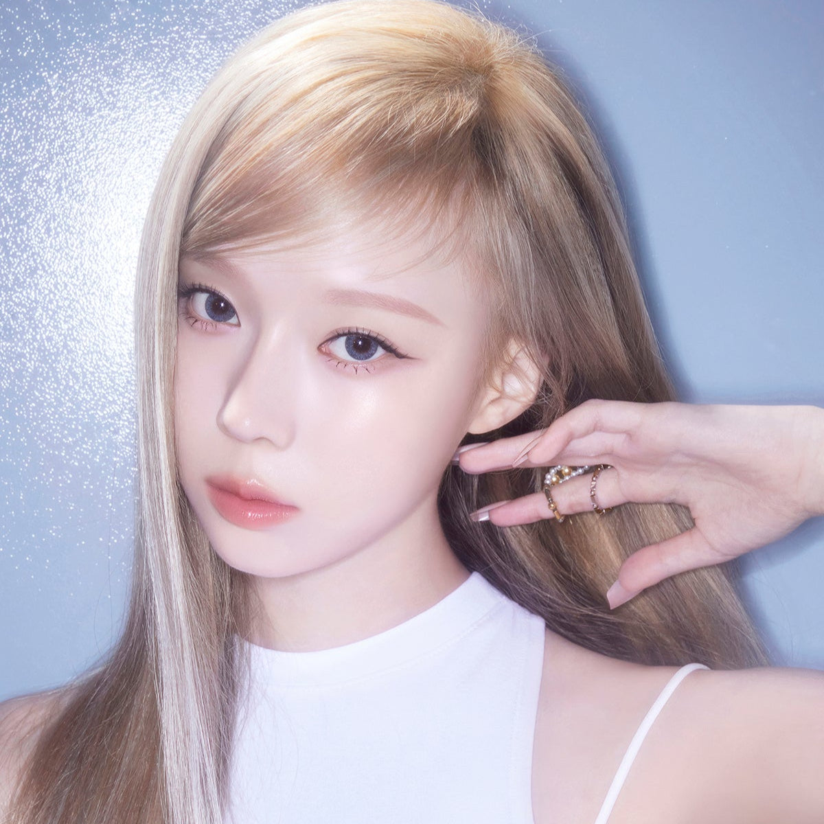 Model wearing ESPOIR BE GLOW FOUNDATION SPF27 PA++ highlighting radiant skin.