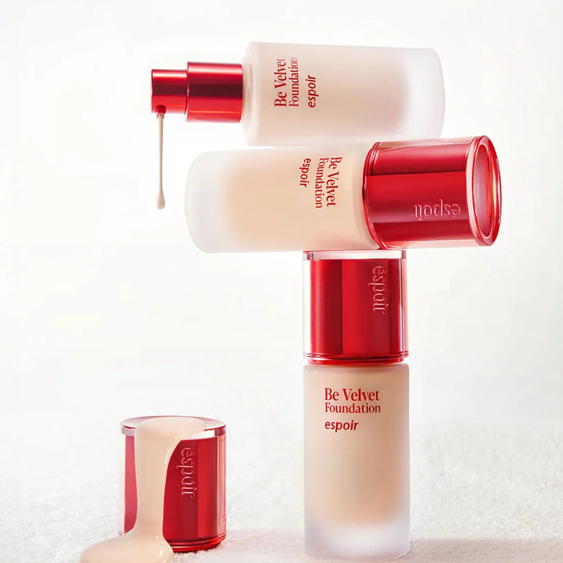 ESPOIR BE VELVET FOUNDATION SPF22 PA++ bottles stacked with luxurious creamy texture.