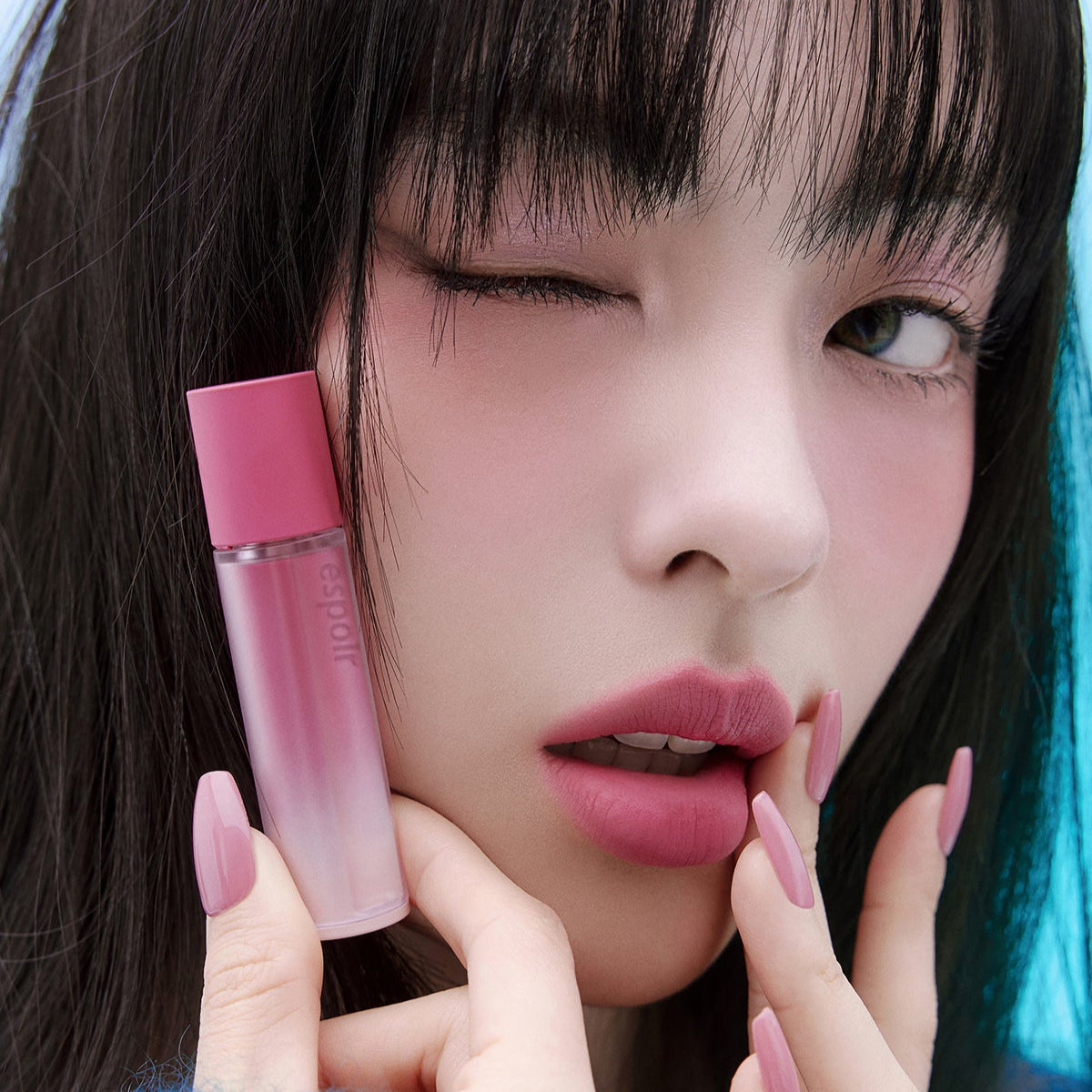 Woman with ESPOIR Couture Lip Tint Fitting Blur in pink shade applying lip tint