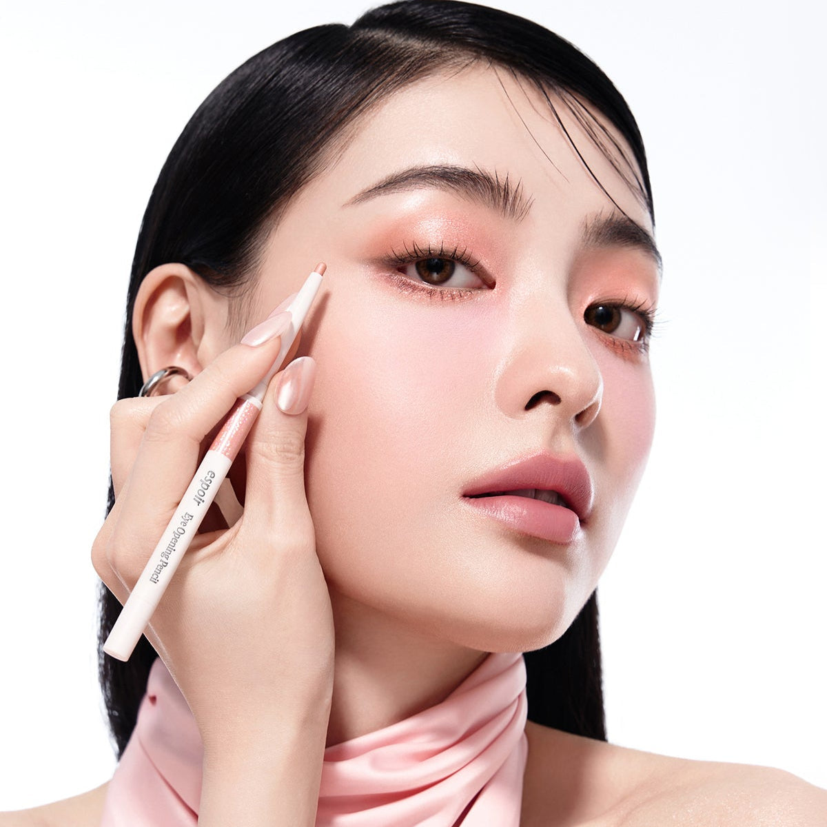 Model applying ESPOIR Eye opening pencil for a striking eye makeup look