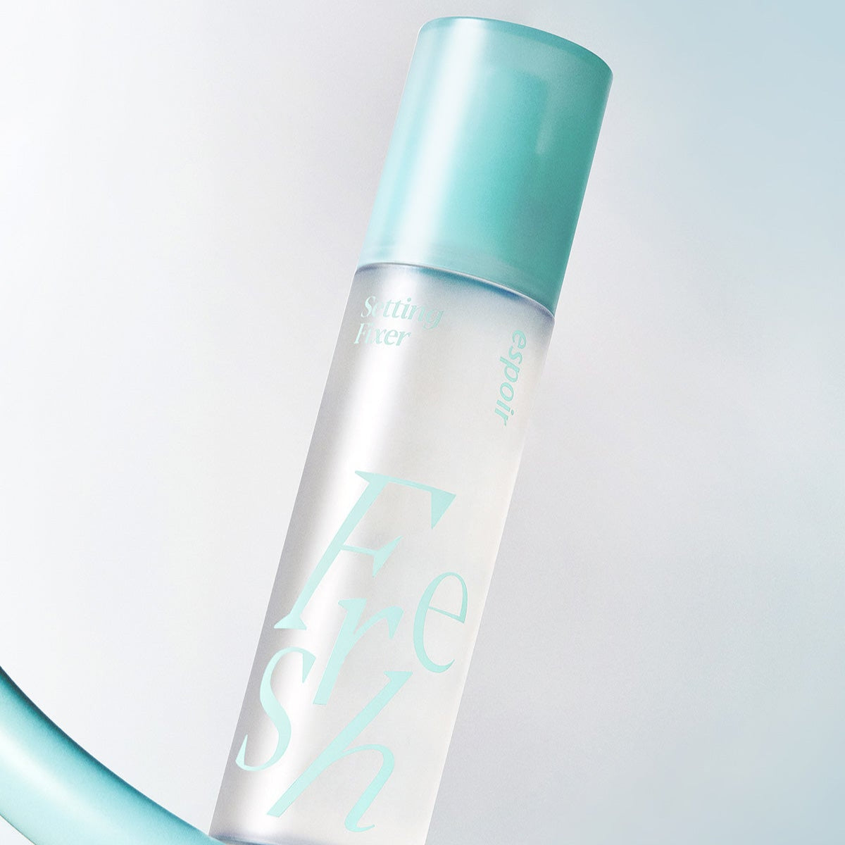 ESPOIR Fresh Setting Fixer 100ml spray bottle with turquoise cap on a light background.