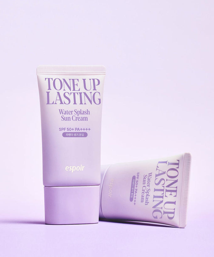 ESPOIR Water Splash Sun Cream Tone Up Lasting SPF 50+ PA++++ in purple packaging on a pastel background.