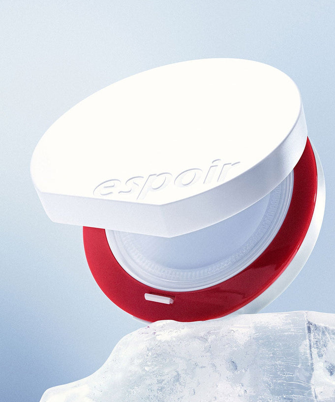 ESPOIR Bevelvet Sebumcut Cooling Cushion on ice, showcasing its sleek design and cooling properties.