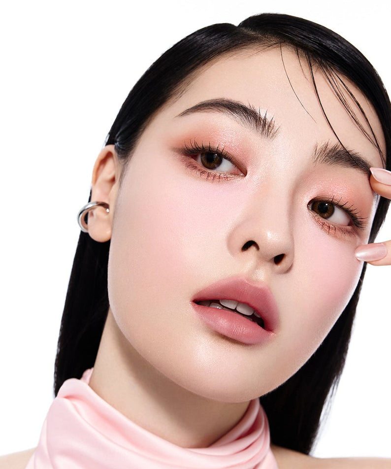 Model using ESPOIR Eye opening pencil for a radiant eye look, showcasing the product's enhancing effect.