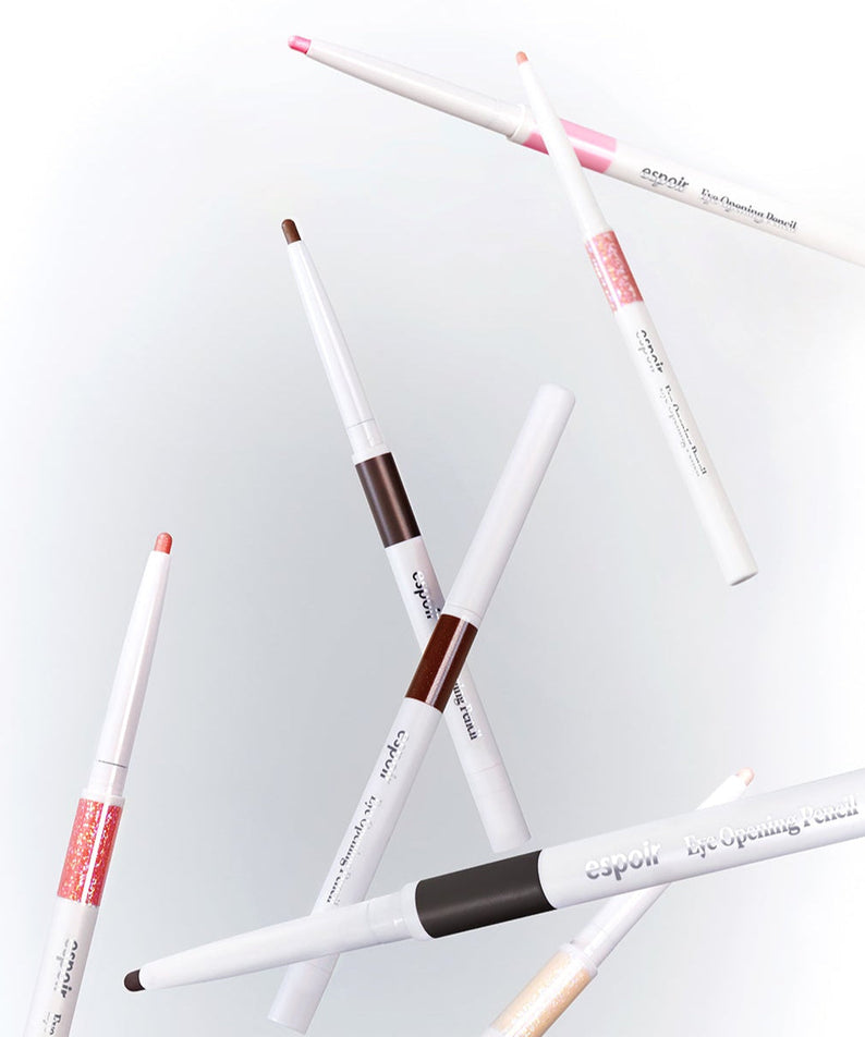 Various shades of ESPOIR Eye opening pencil floating in a stylish arrangement, showcasing their colors and sleek design.