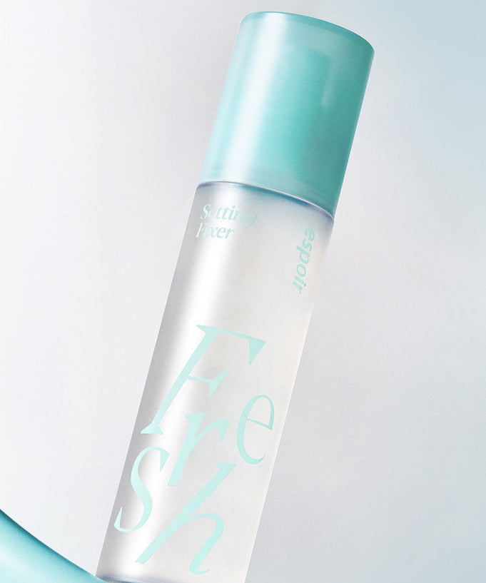 ESPOIR Fresh Setting Fixer 100ml spray bottle with turquoise cap on a light background.