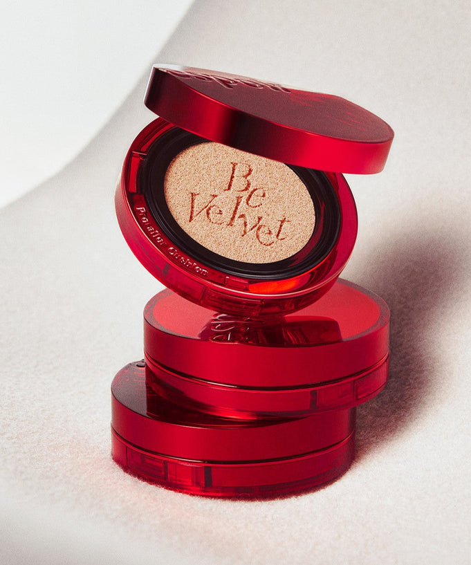 Stack of ESPOIR Pro Tailor Be Velvet Cover New Glass Cushion compacts in vibrant red packaging.