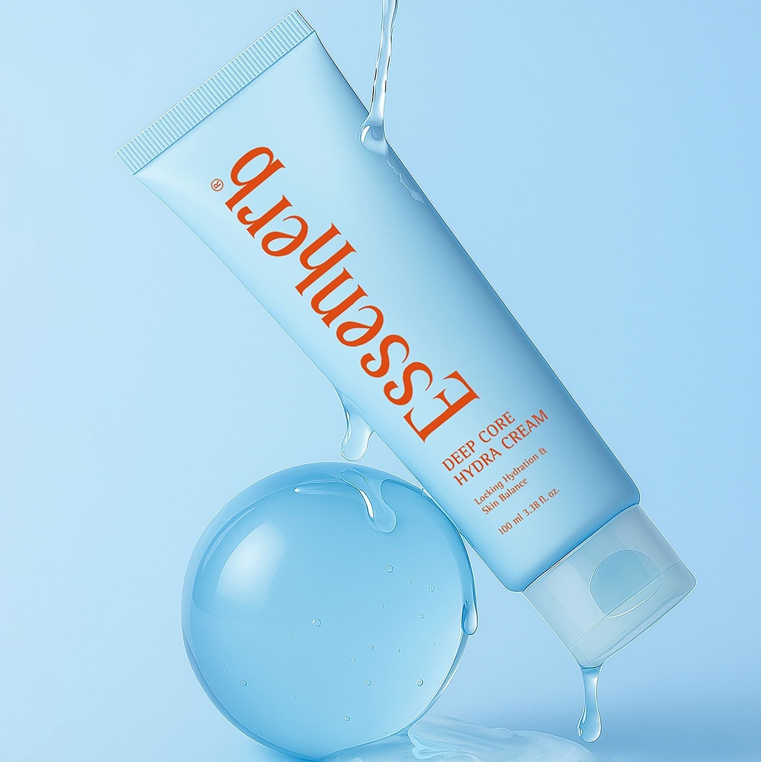 ESSENHERB Deep Core Hydra Cream 100ml tube with water droplets on a blue background