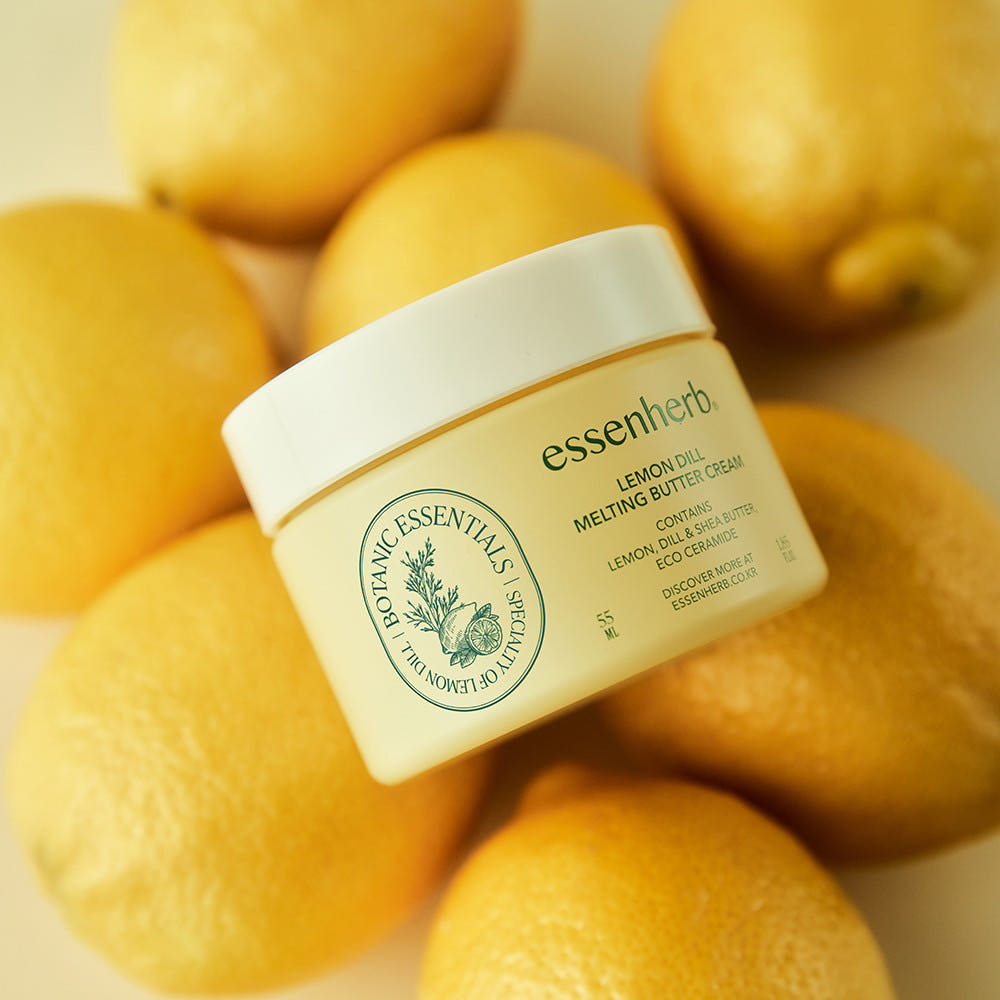 ESSENHERB Lemon Dill Melting Buttercream 55ml jar with fresh lemons backdrop